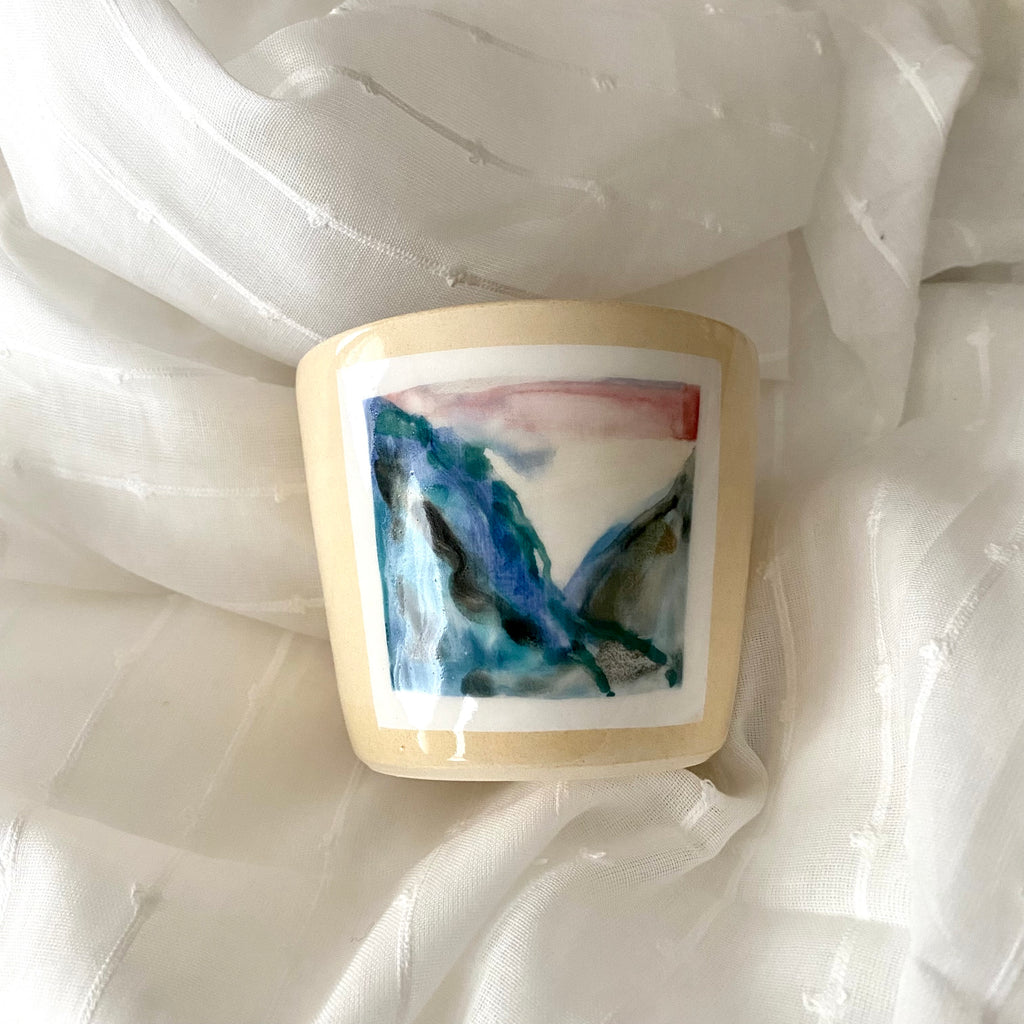 Pretty Cream Colored Ceramic Cup By A MANO in MPLS with a Hand Painted Blue Mountain Landscape