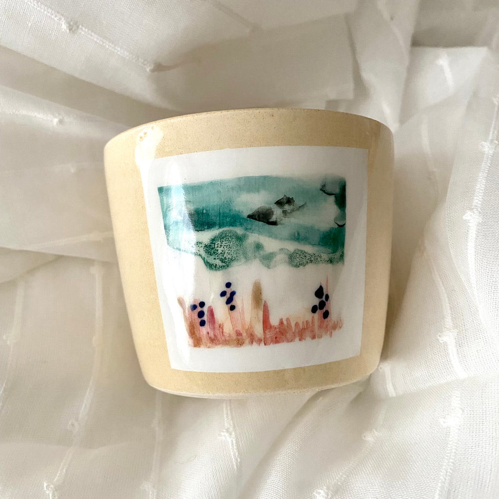 Serene A MANO Ceramic Hand Made Cup with Painted Landscape on White Fabric