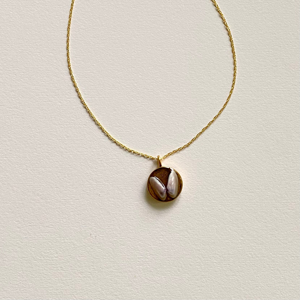 Shell Pendant Charm on Gold Chain Necklace at Golden Rule Gallery 