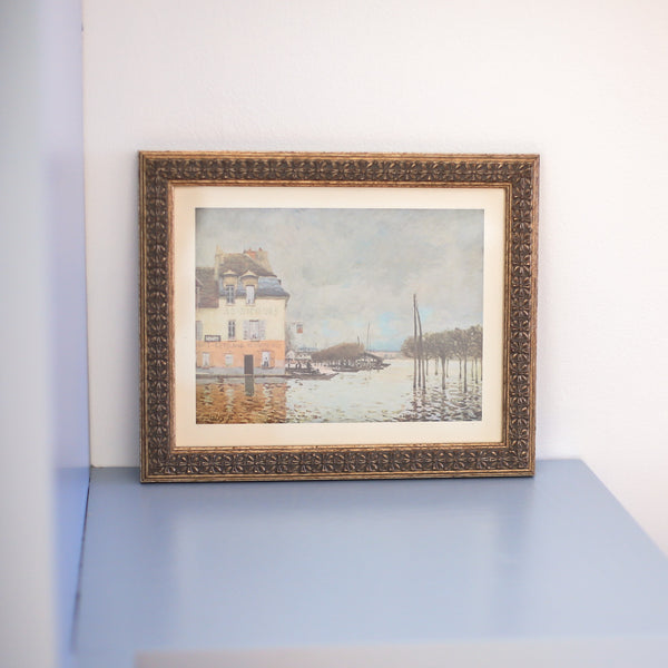 Professionally framed vintage Sisley impressionist seascape styled on a blue counter