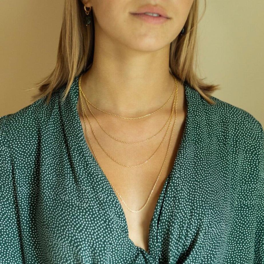 Trendy gold layering chains on model | Dainty Gold Layering Chains on Model | 1.3 MM Gold Chain | 14KT Gold Necklace Chain | Gold Chain for Layering | Golden Rule Gallery | Excelsior, MN | Protextor Parrish Jewelry | Minnesota Artists | MN Made Jewelry