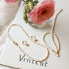 Timeless White Pearl Jewelry with Florals in a Vase
